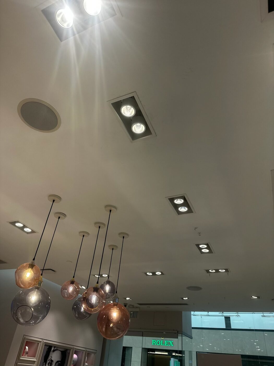 Pendant cluster and display lighting serviced in a storefront