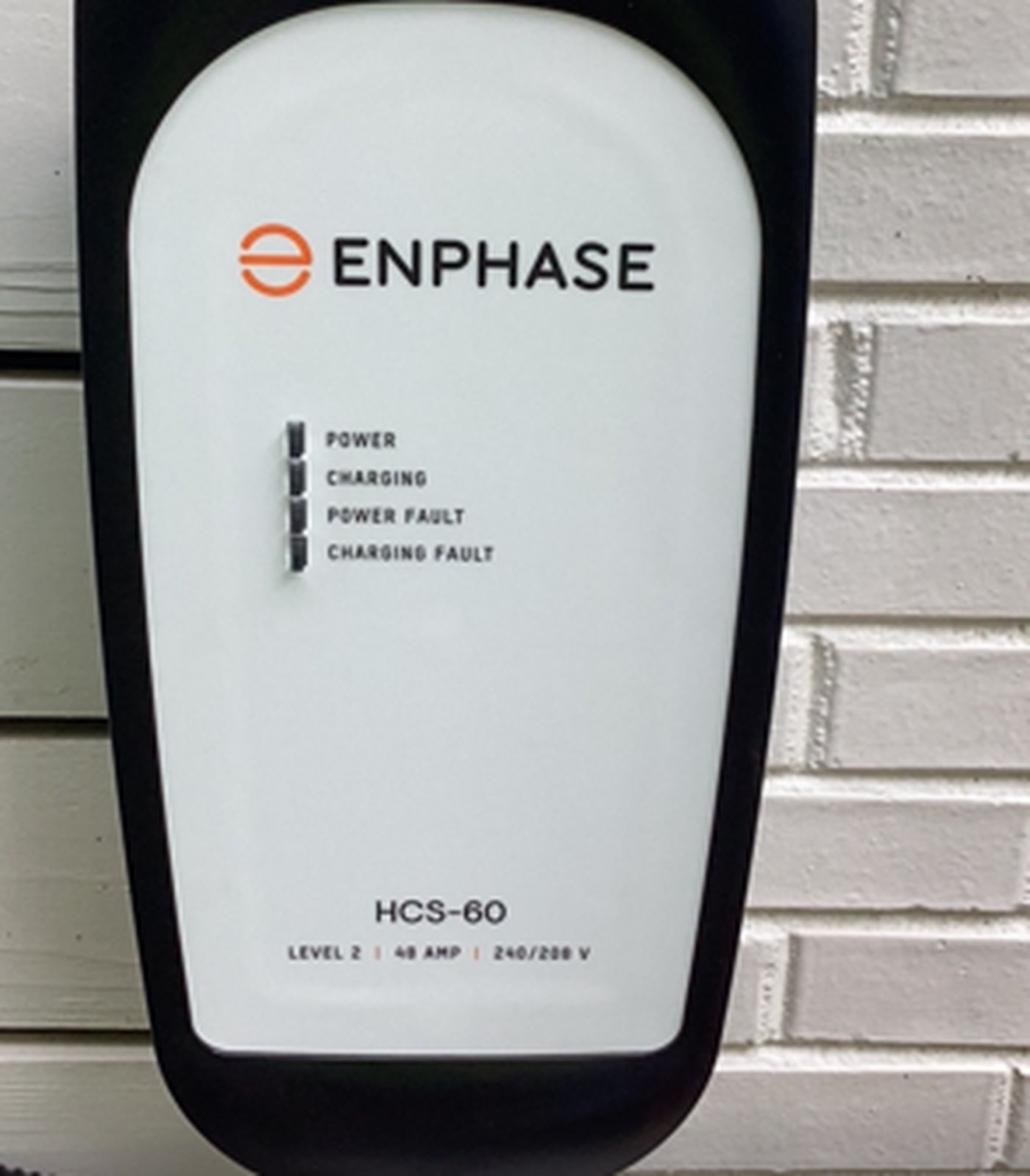Enphase HCS-60 Level 2 charger installed on exterior brick